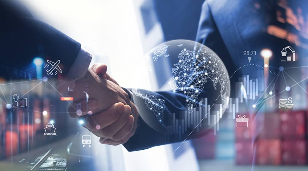 Two people shaking hands, overlaid with global network graphics and various icons, symbolizing international business and connectivity.